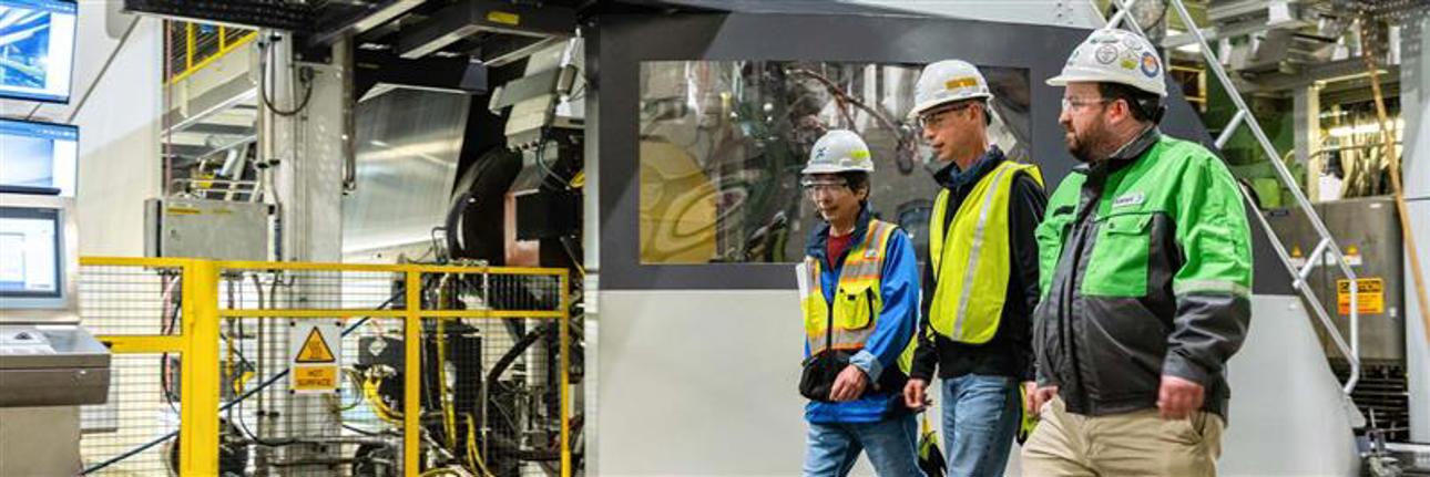 From left to right: Noboru Morita, Senior Vice President, NDP; Andrew Cooper, Vice President of Operations, NDP; and Joe Lambie, Project Manager and Team Lead, Valmet, discuss the current state of the OptiCalender and its sucess while walking through the Longview, Washington facility.