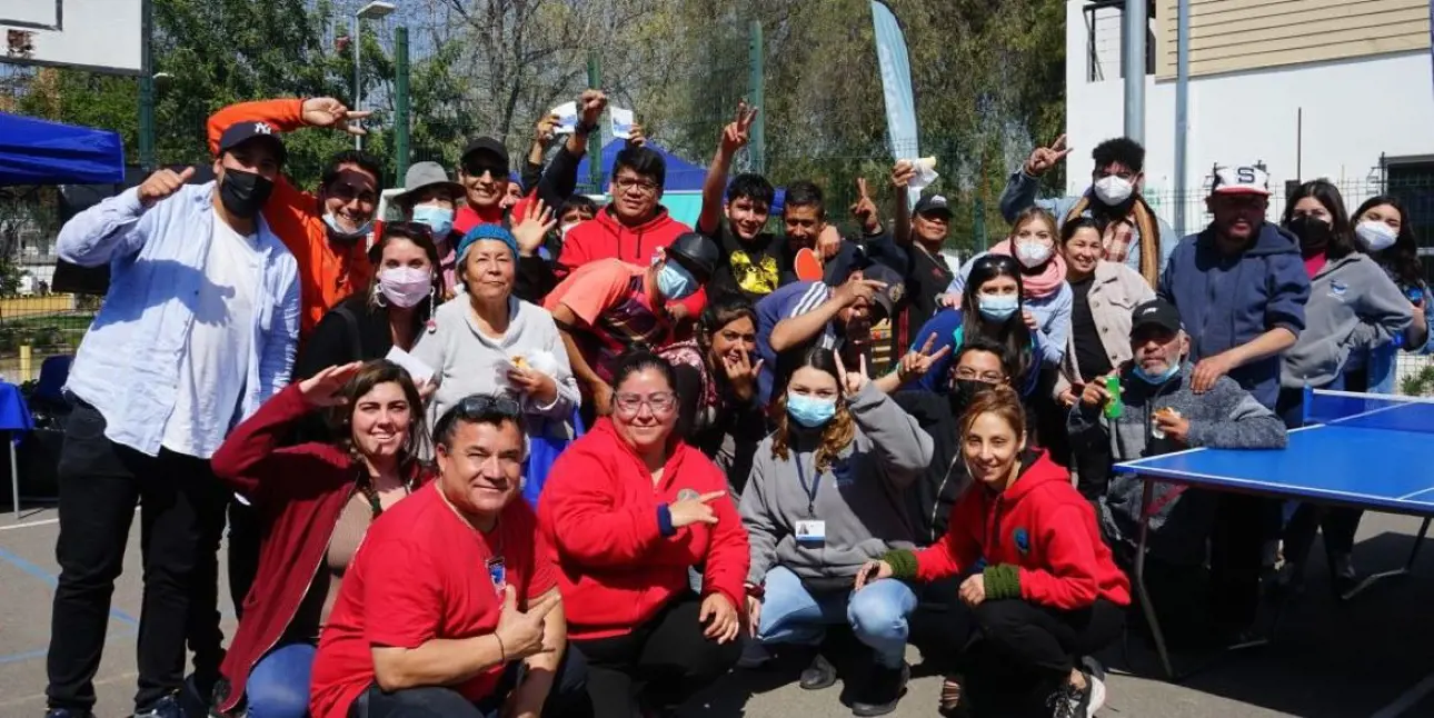 People gathered together thumbs up